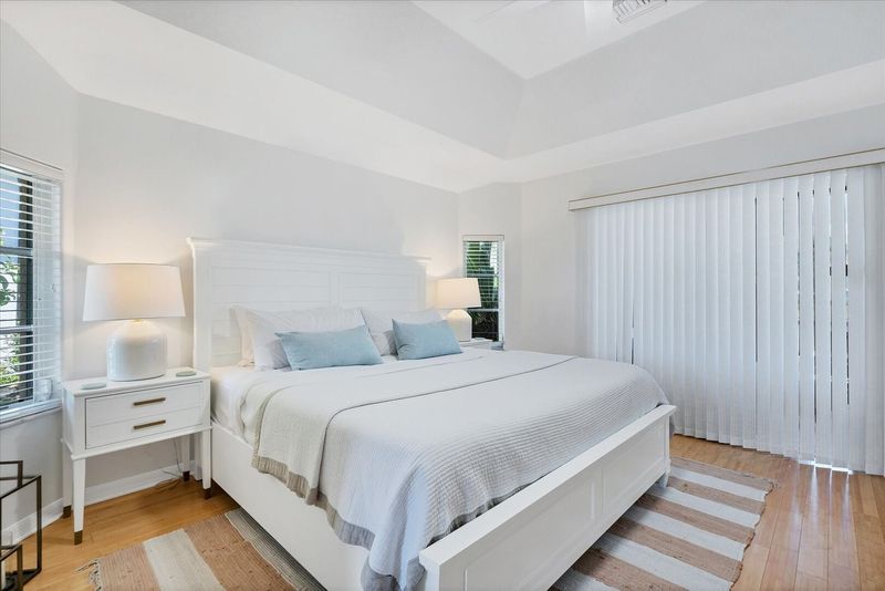 Primary Bedroom with king bed, lanai access, ensuite and 50-inch Smart TV
