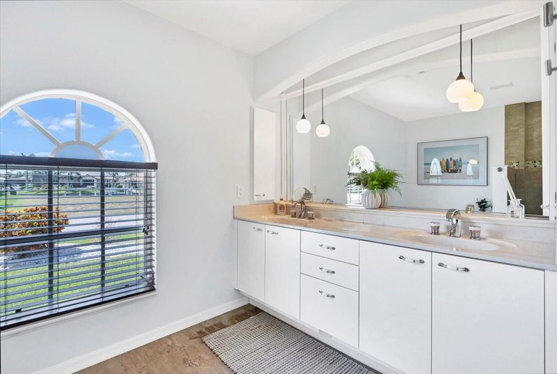 Ensuite features double vanities, walk-in shower and soaking tub