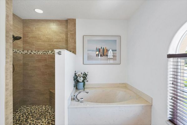 Ensuite features double vanities, walk-in shower and soaking tub