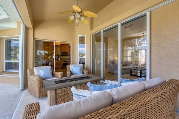 Spacious outdoor area overlooking the water with a TV on a rolling cart!