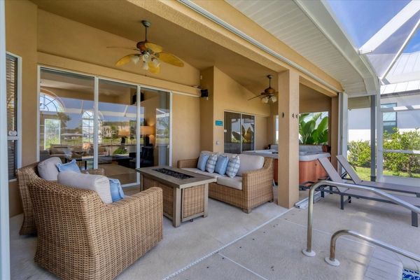 Spacious outdoor area overlooking the water with a TV on a rolling cart!