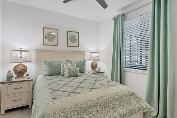 Guest bedroom with one queen bed and 45-inch Smart TV