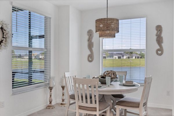 Dining table overlooking pond. Table seats 4
