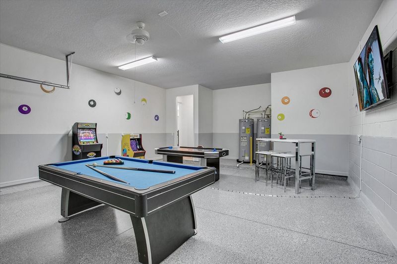 Game Room
65" Smart TV
Pool Table
Air Hockey
2 Video Arcades
