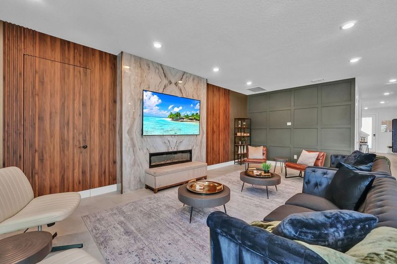 Gather in the spacious living room, designed with comfort in mind and ideal for entertaining guests or enjoying family time