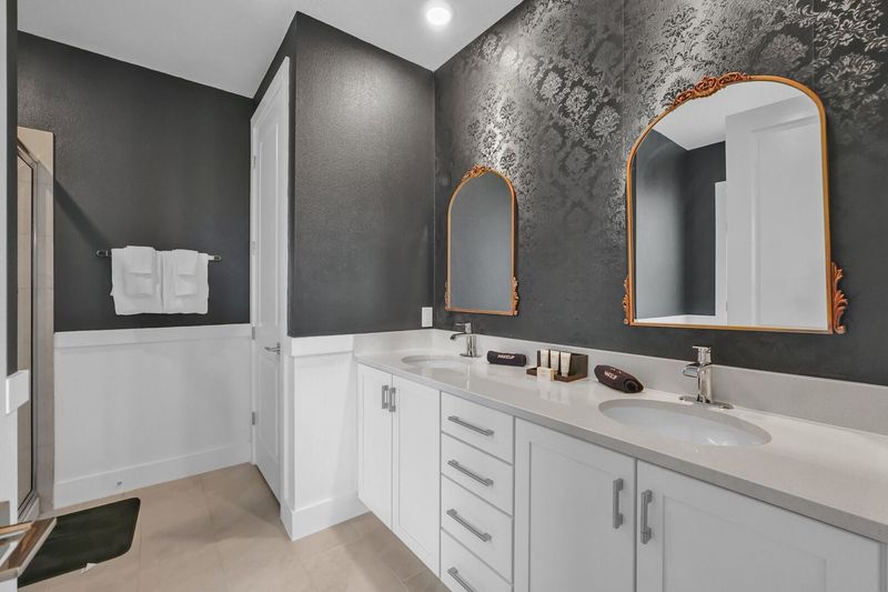 Enjoy the convenience of an en-suite bathroom featuring a walk-in shower for a refreshing start to your day