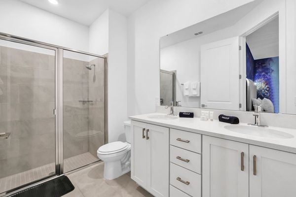 Enjoy the convenience of an en-suite bathroom featuring a walk-in shower for a refreshing start to your day