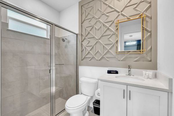 Enjoy the convenience of an en-suite bathroom featuring a walk-in shower for a refreshing start to your day