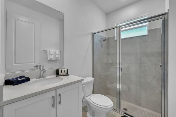 Enjoy the convenience of an en-suite bathroom featuring a walk-in shower for a refreshing start to your day