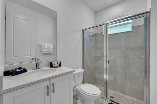 Enjoy the convenience of an en-suite bathroom featuring a walk-in shower for a refreshing start to your day