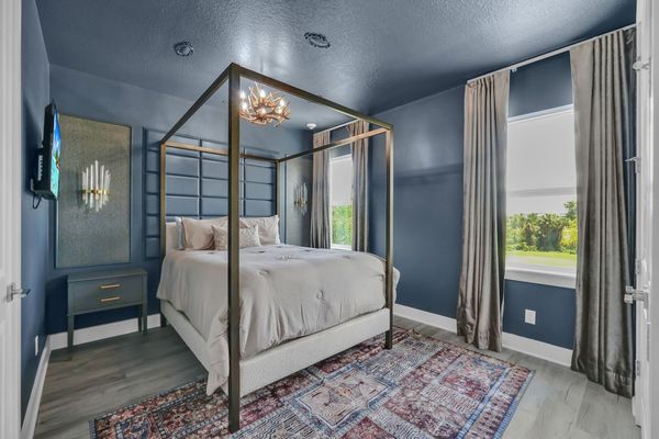 Sink into comfort with this sophisticated bedroom, offering a serene and inviting space for unwinding and relaxation