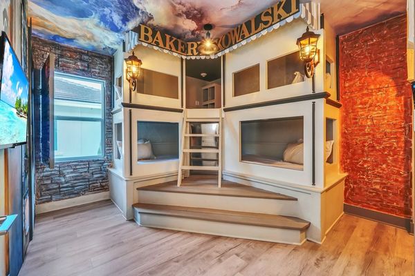 Perfectly designed for kids or guests, this room features creative bunk beds