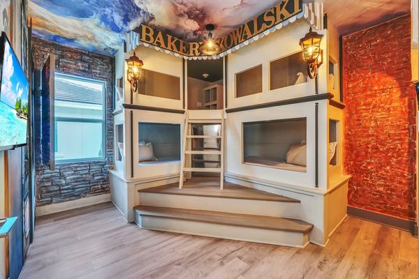 Perfectly designed for kids or guests, this room features creative bunk beds