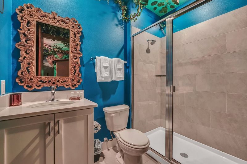 Ensuite bath with design-coordinated fixtures and finishes that enhance the overall aesthetic