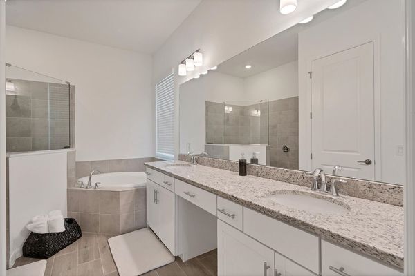 Ensuite features a walk-in shower, soaking tub and double vanities
