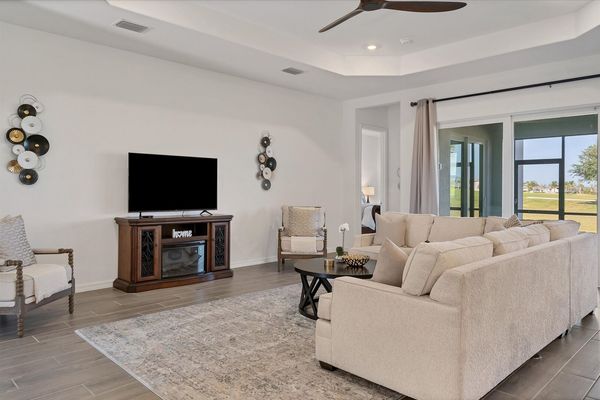 Beautiful, bright, open living space. Living room features large, comfy, sectional sofa and 60" Smart TV