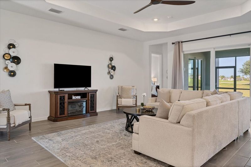Beautiful, bright, open living space. Living room features large, comfy, sectional sofa and 60" Smart TV
