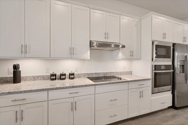 Gorgeous, fully-equipped kitchen with all new stainless steel appliances and large kitchen island that seats 4