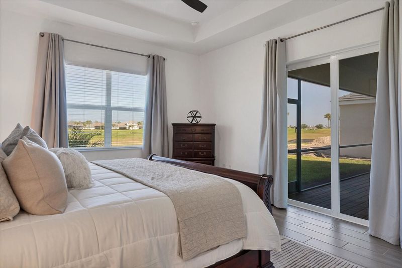 Primary bedroom with king bed, lanai access and ensuite
