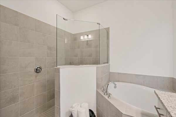 Ensuite features a walk-in shower, soaking tub and double vanities