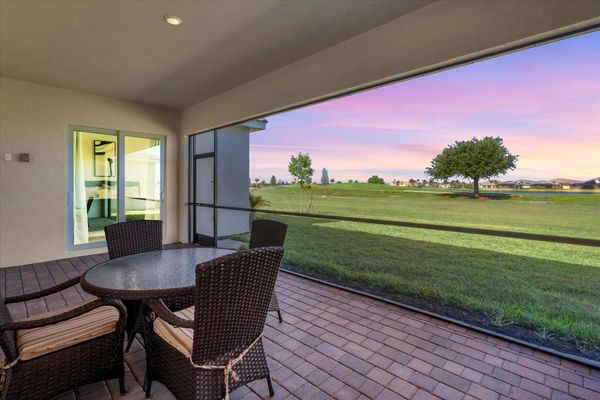 Lanai overlooking golf course and pond. Lanai faces west