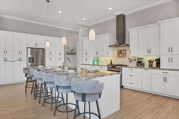 Gorgeous, bright, fully-equipped kitchen with stainless steel appliances, gas range, and plenty of storage & countertop space. Kitchen island seats 6