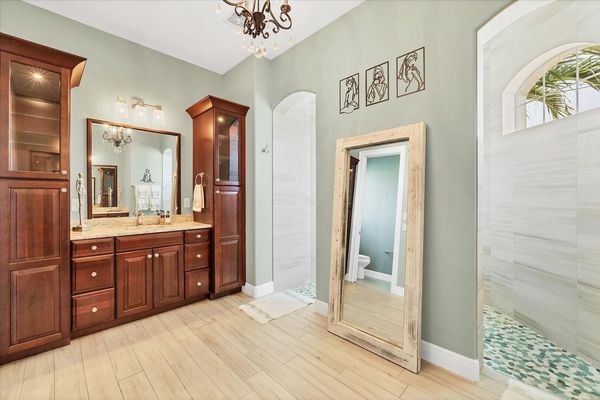 Beautiful primary en suite with large walk-in shower and double vanities