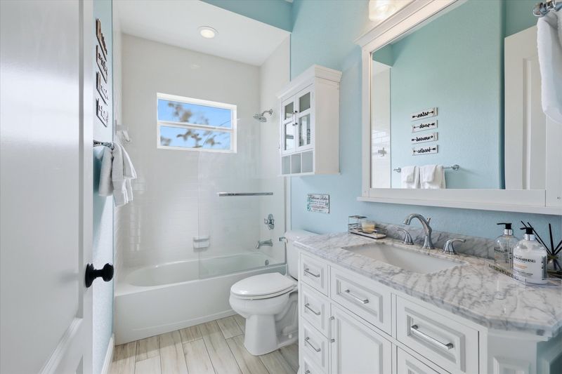 Shared bathroom with shower/tub combo