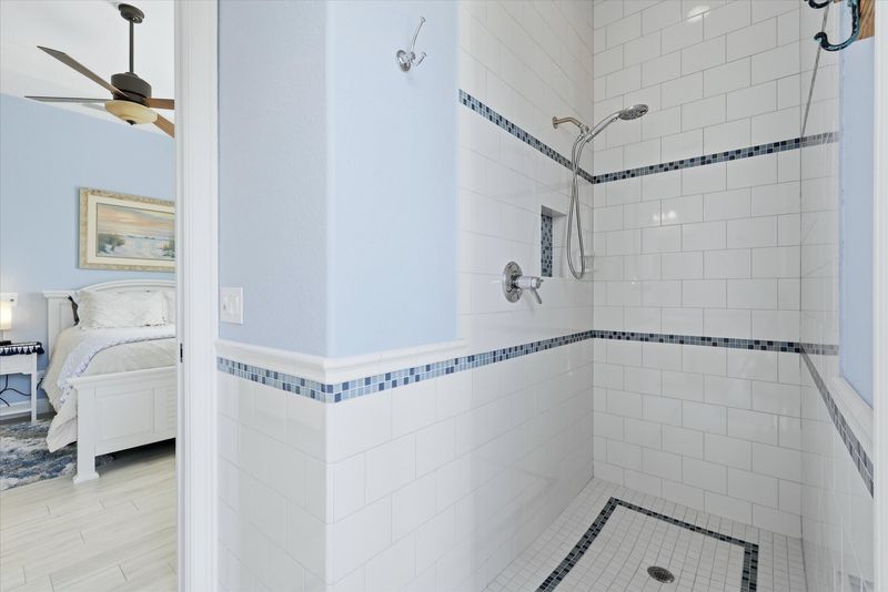Attached bathroom with walk-in shower and lanai access