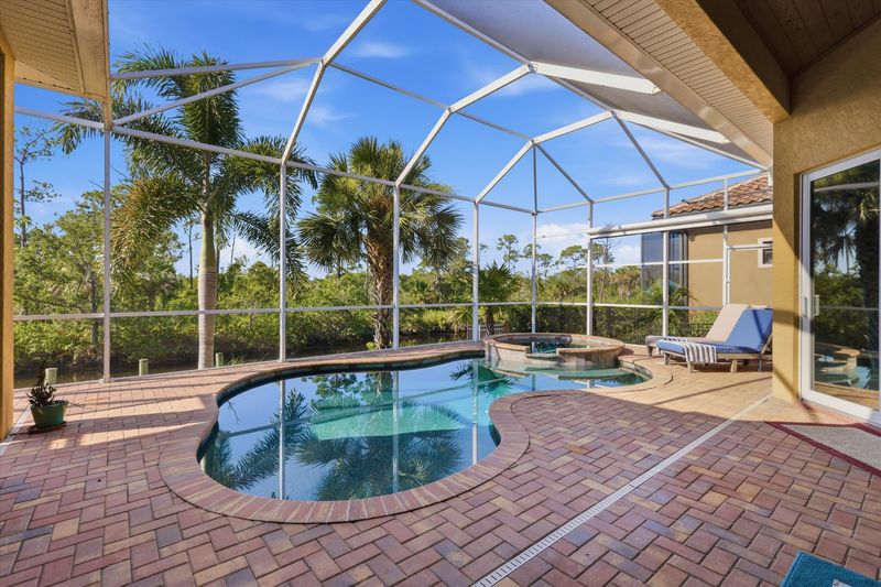 Sparkling private saltwater pool & spa overlooking water. Lanai features remote controlled privacy screens. Pool size is 17'L x 10'W x 6'D