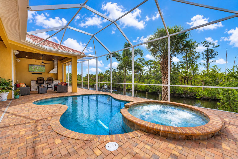 Sparkling private saltwater pool & spa overlooking water. Lanai features remote controlled privacy screens. Pool size is 17'L x 10'W x 6'D