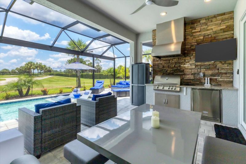 Gorgeous outdoor living space with private pool loverlooking golf course