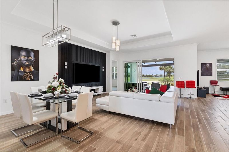 Beautiful, bright, open living space. Dining table seats 6