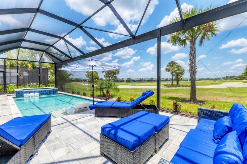 Gorgeous outdoor living space with private pool loverlooking golf course. Pool size: 10' x 24' x 5.5'D. Spa size: 6' x 6'