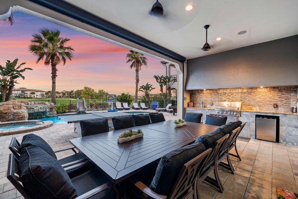 Relax and unwind in the outdoor sofa area with views of the pool area