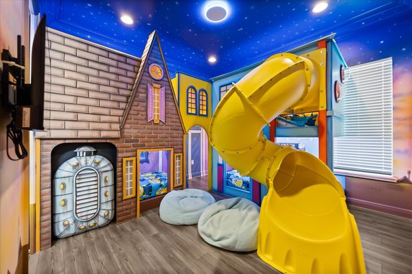 Play all day in this custom galaxy game room.