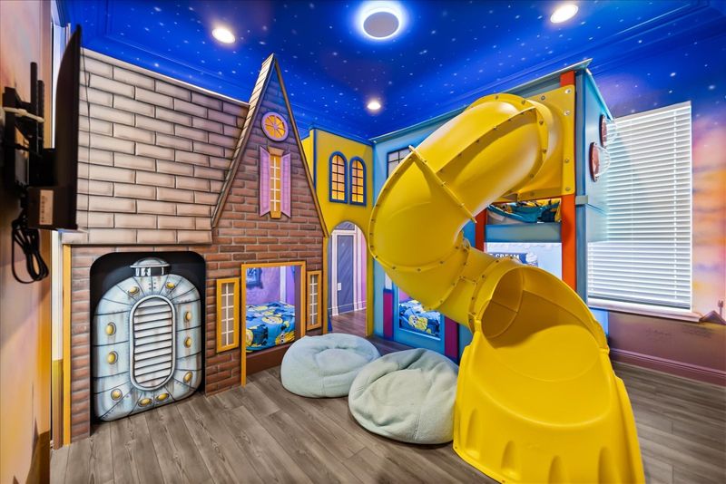 Play all day in this custom galaxy game room.
