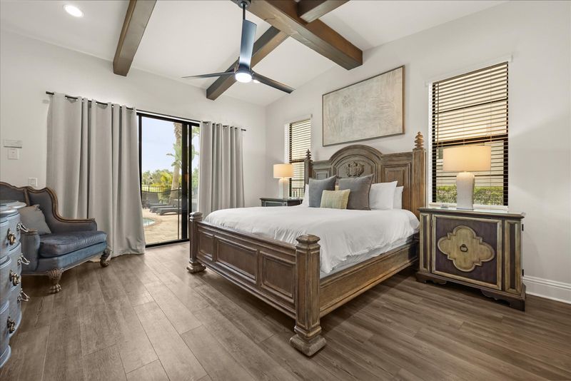 The downstairs master bedroom features a king bed and en-suite bathroom