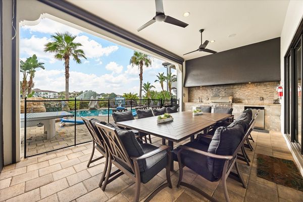 Relax and unwind in the outdoor sofa area with views of the pool area