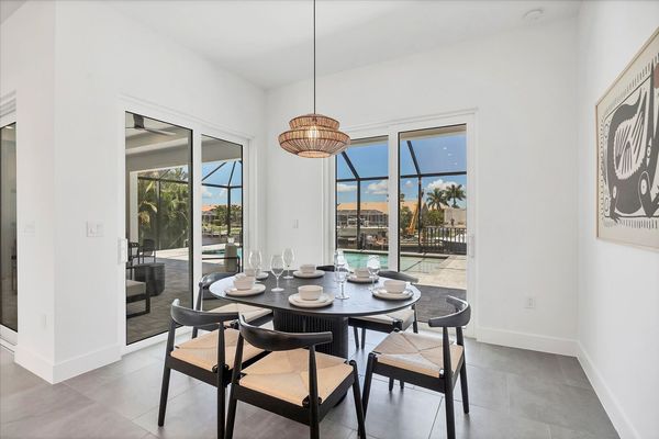 Dining area overlook pool and canal. Dining table seats 6
