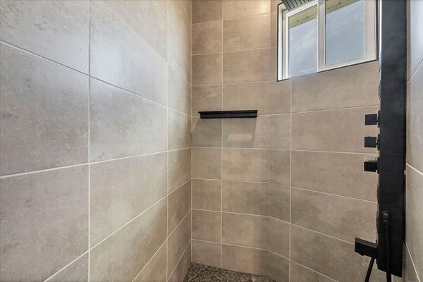 En suite with large walk-in shower, double vanities and soaking tub