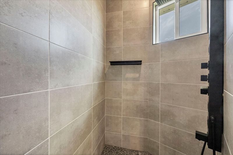 En suite with large walk-in shower, double vanities and soaking tub