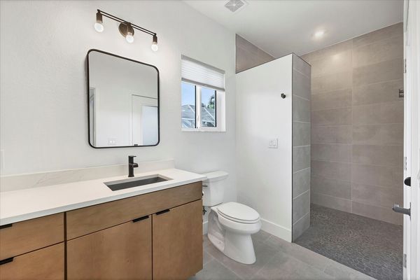 Guest bathroom featuring large walk-in shower