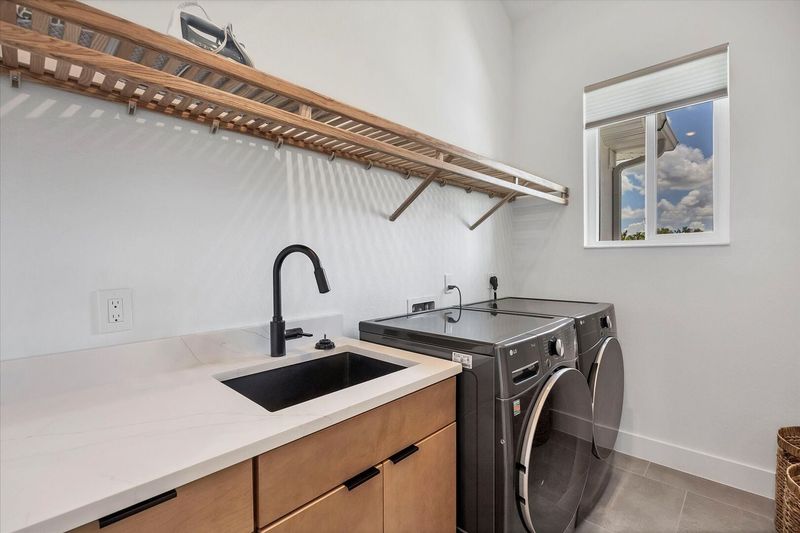 Laundry room with full-size washer and dryer