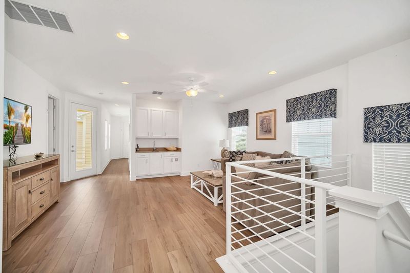 Gather in the 2nd floor loft area, a versatile space perfect for lounging, watching movies, or enjoying casual conversations.