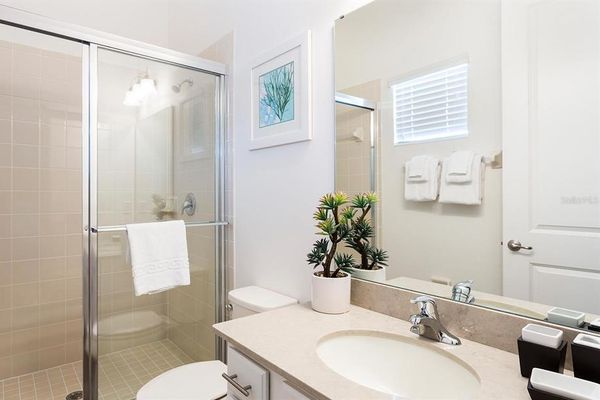 Enjoy the convenience of an en-suite bathroom featuring a walk-in shower for a refreshing start to your day