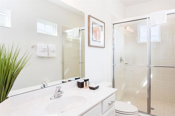 Enjoy the convenience of an en-suite bathroom featuring a walk-in shower for a refreshing start to your day