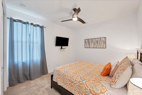 Guest bedroom 2 features one queen bed and 43-inch Smart TV