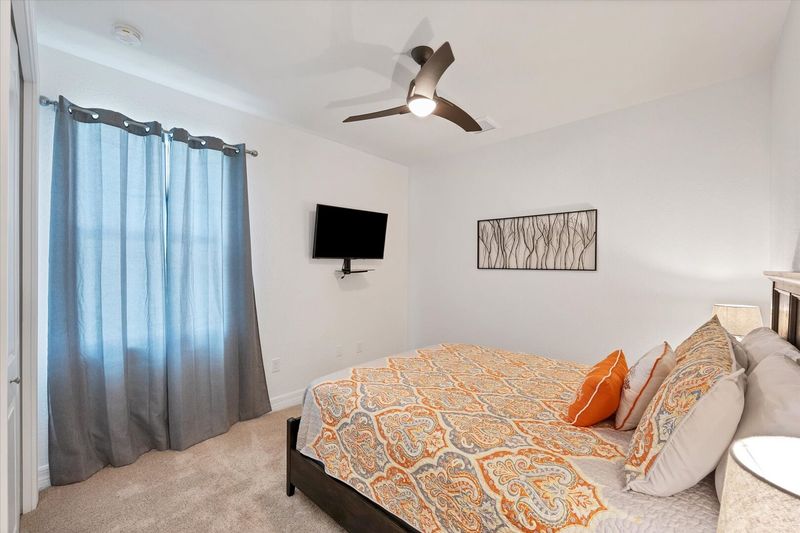 Guest bedroom 2 features one queen bed and 43-inch Smart TV