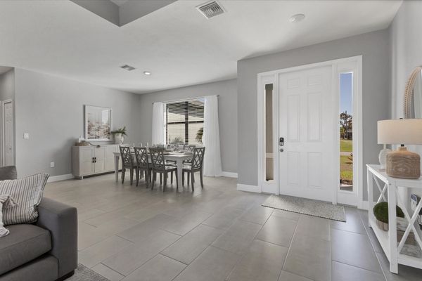 Beautiful, bright, open living area. Dining table seats 8